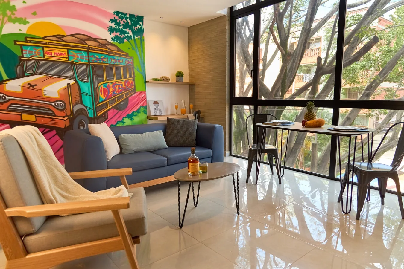 Living and dining area of a furnished apartment at Rosa Negra in Medellín.